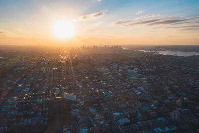 High angle view of city against sky during sunset