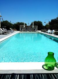 Swimming pool against clear blue sky