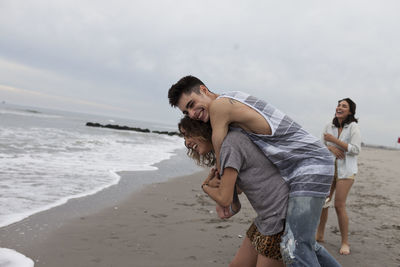 Friends hanging out on the beach