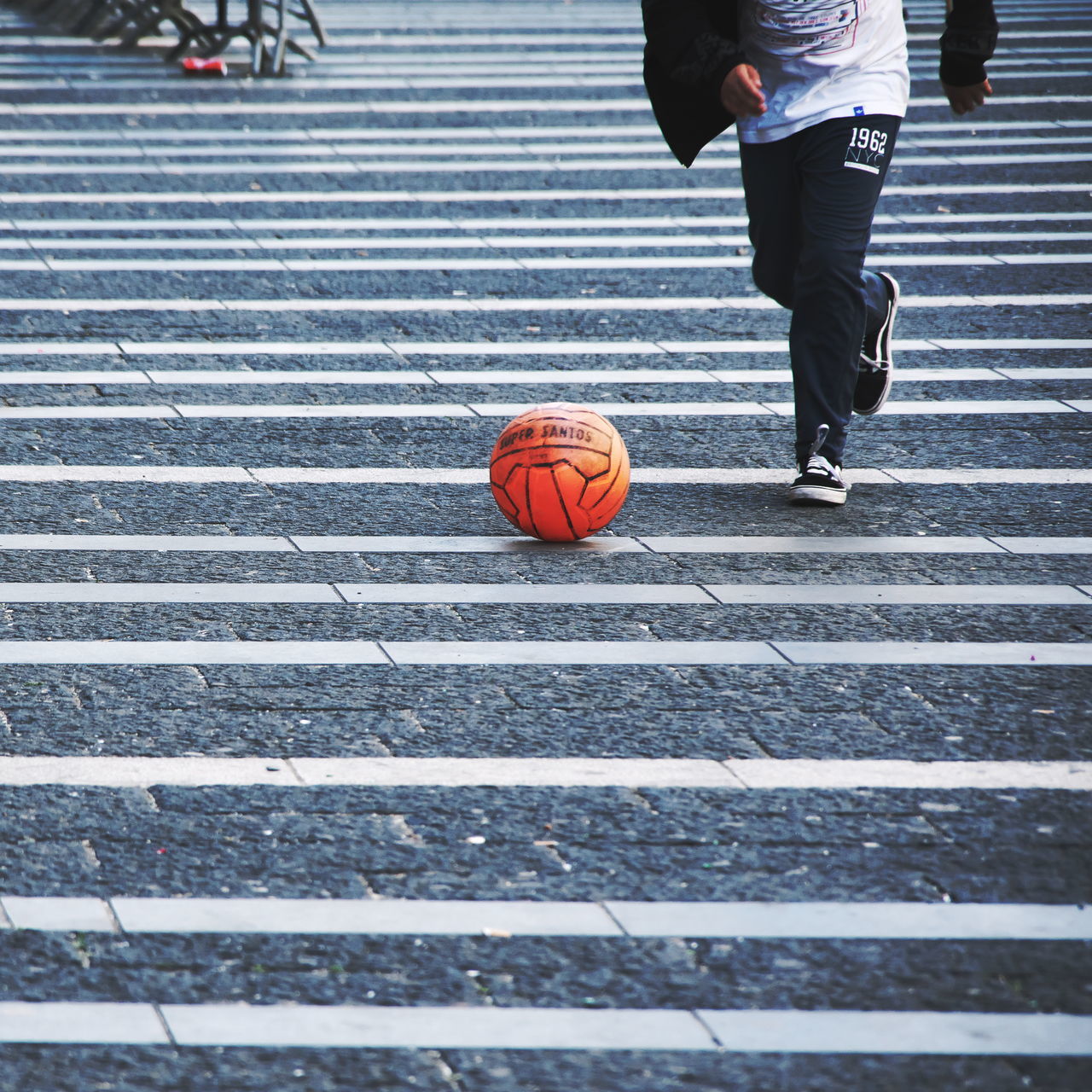 city, crosswalk, day, street, low section, crossing, real people, zebra crossing, road, walking, men, architecture, road marking, transportation, human leg, one person, striped, incidental people, outdoors