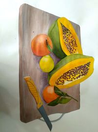 High angle view of oranges on cutting board