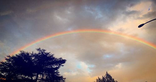 Low angle view of rainbow in sky