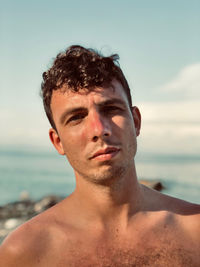 Close-up of young man at beach