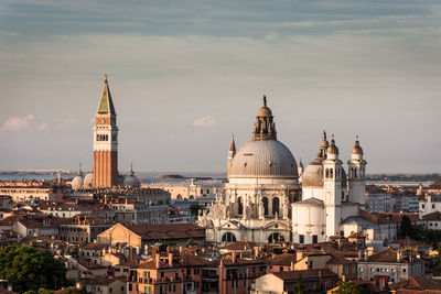 View of buildings in city against sky