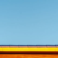 Low angle view of train against clear sky