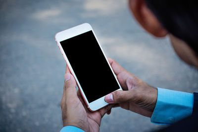 Low angle view of man using mobile phone