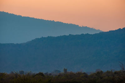 Scenic view of mountains against sky during sunset