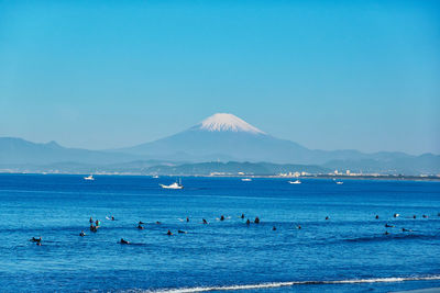 Scenic view of sea against clear blue sky