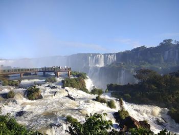 Scenic view of waterfall against clear sky