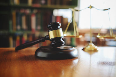 Close-up of gavel at desk in office