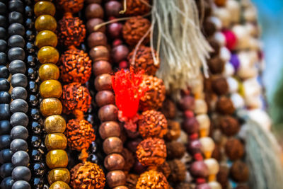 Close-up of multi colored jewelry for sale in market