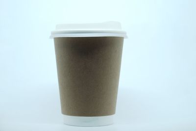 Close-up of coffee cup against white background