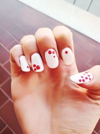 Close-up of woman with nail art