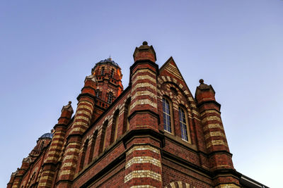 Low angle view of old building against clear sky