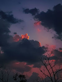 Low angle view of silhouette trees against sky at sunset