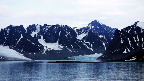 Scenic view of snowcapped mountains against sky