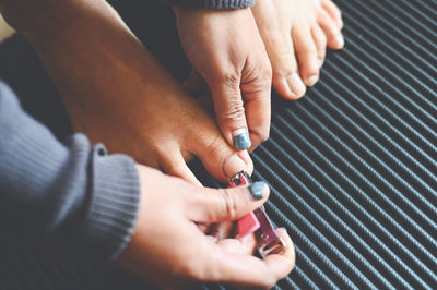 Cropped image of man holding metal