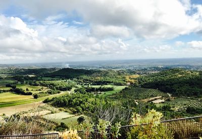 Scenic view of agricultural field against sky