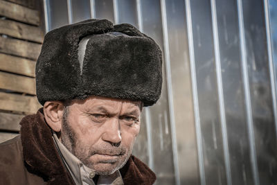 Portrait of man wearing hat looking away