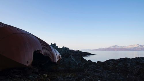 Panoramic view of sea and mountains against sky