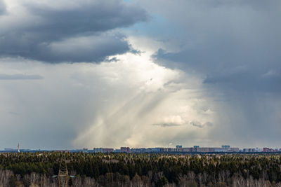 Panoramic view of agricultural field against sky