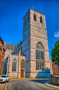 Low angle view of building against blue sky