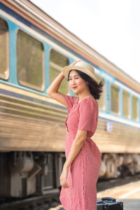Woman standing on a train