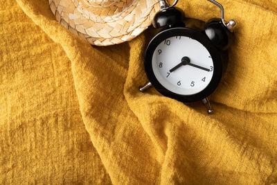 High angle view of clock on table