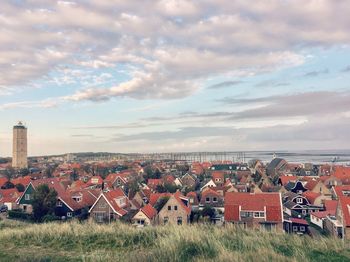 Houses in town against sky