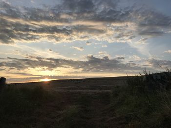 Scenic view of sunset over land