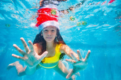 Young woman swimming in pool