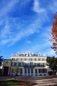 Buildings against cloudy sky
