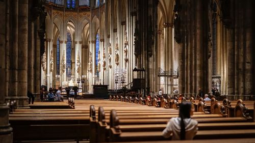 Rear view of people walking in church