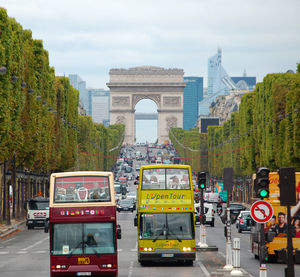 View of cars on street in city