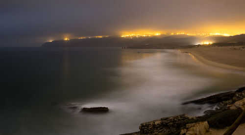 Scenic view of sea against sky at sunset