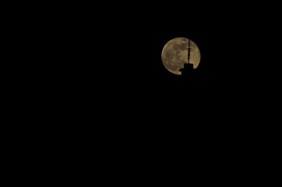 Low angle view of moon against sky at night