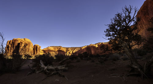 Scenic view of rocks against clear sky