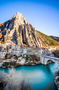 Scenic view of river against blue sky