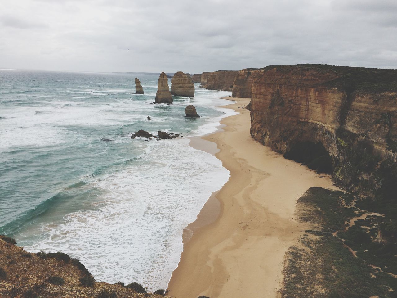 sea, beach, travel destinations, nature, wave, scenics, vacations, rock - object, sand, outdoors, coastline, beauty in nature, horizon over water, no people, day, water, sky