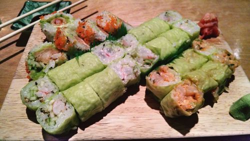 Close-up of served food on wooden table