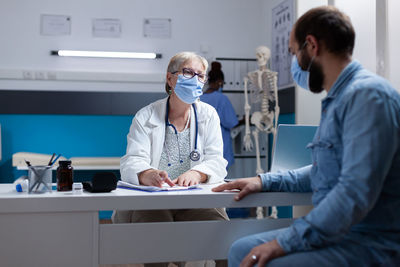 Doctor examining patient at clinic