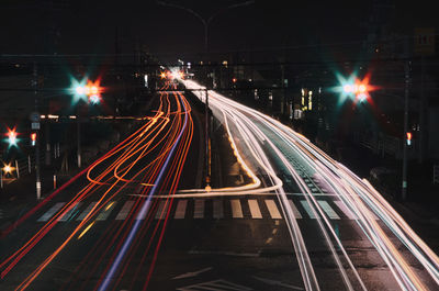 High angle view of light trails on road at night