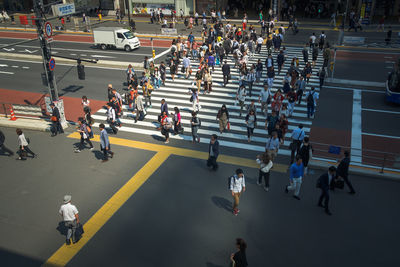 High angle view of people walking on city street