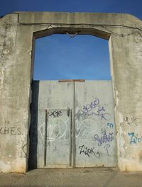 Low angle view of built structure against blue sky