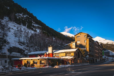 Sunset light illuminating bars, restaurants and residential building in el tarter and soldeu andorra