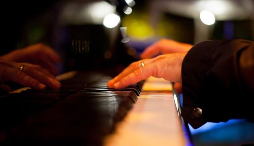 Cropped image of pianist playing piano