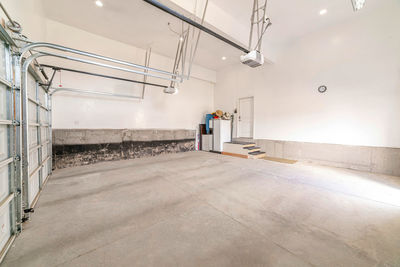 Rear view of man standing on tiled floor in building