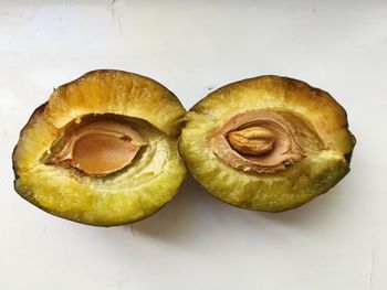 Close-up of fruits against white background