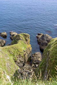 High angle view of rocks in sea