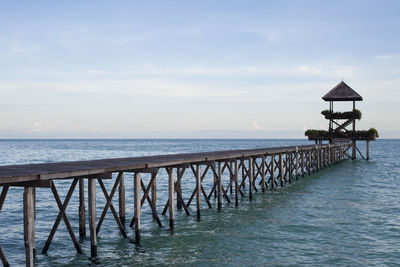 Pier over sea against sky